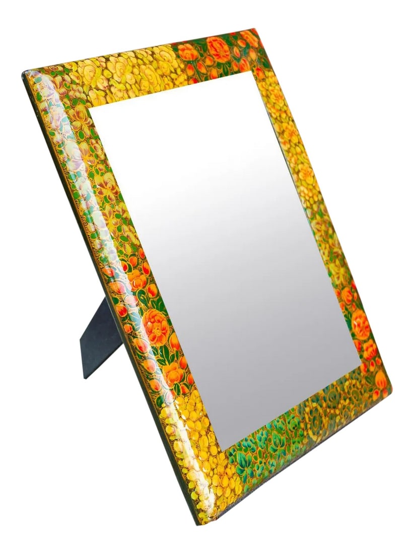 Mid 20th Century Paper Mache Floral Mirror Frame: This lovely decorative paper mache framed mirror, all hand-painted in a multicolored embellished finish with beautiful detail. This mirror is perfect to add an elegant touch to any table top. 