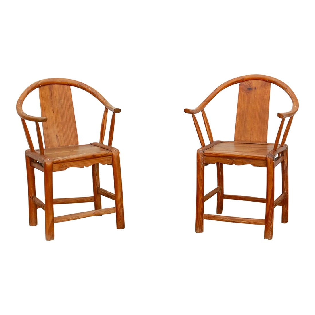Pair of Antique Horse Shoe Chairs: This alluring pair of antique Chinese armchairs, handcrafted in the time-honored traditions, exudes a captivating blend of history and artistry. Their iconic horseshoe silhouette, reminiscent of