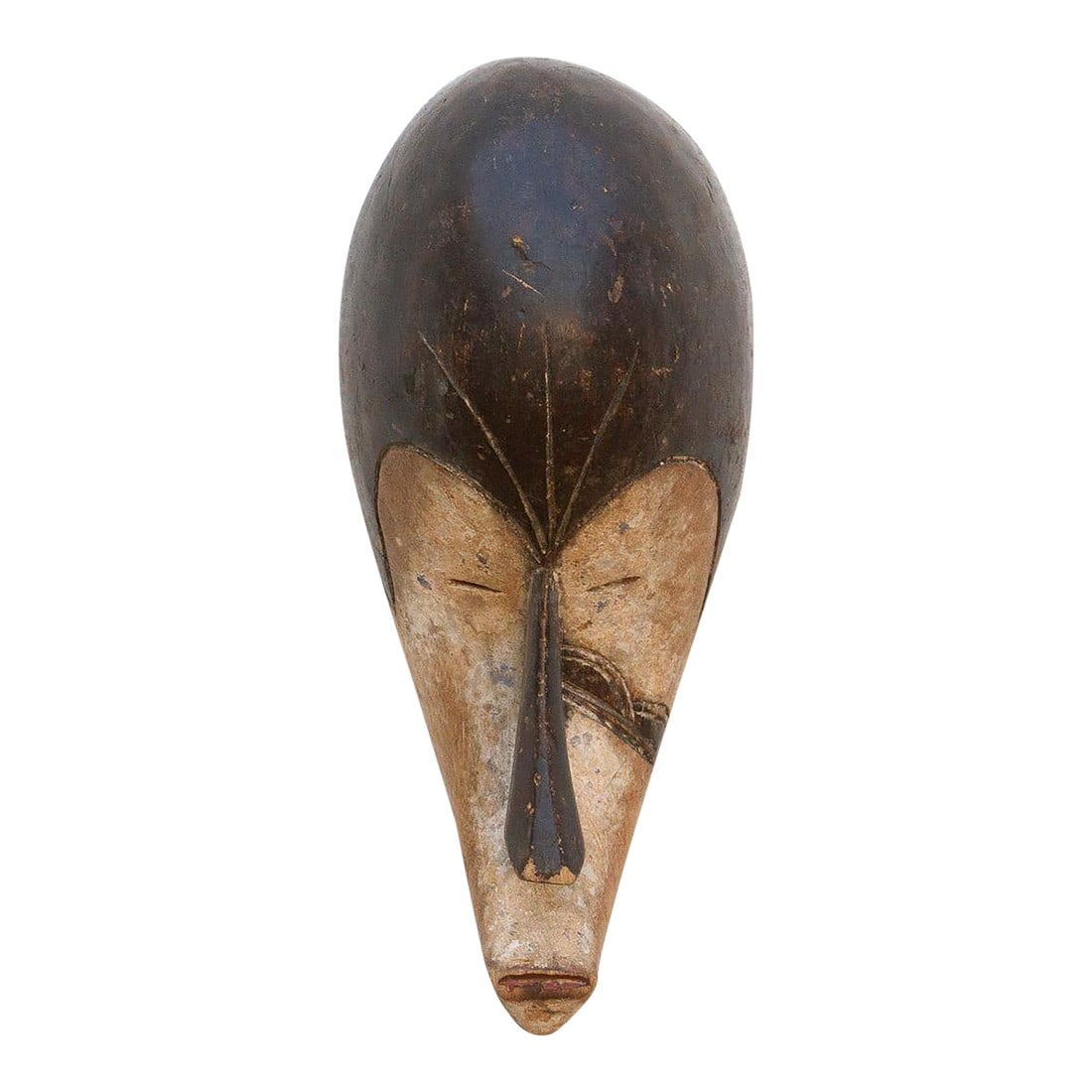 Dance of Spirits African Fang Mask: Discover the captivating allure of authentic African art with this vintage hand-carved wooden mask. Imbued with a rich history and unique story, it offers a glimpse into the diverse cultures and
