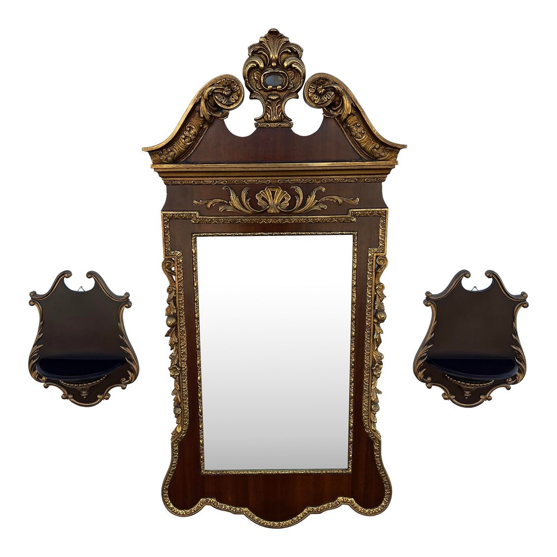 Florentine Style Mahogany Wall Mirror and Shelves, 3 Pieces: A mirror and flanking shelves in a Florentine design style. Elegant gold trim highlights carving along all three pieces and contrasts beautifully with the mahogany in the mirror. Shaping and