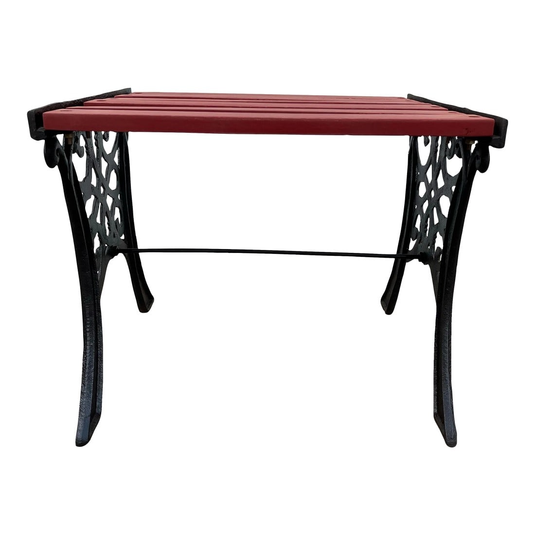 Vintage Outdoor Cast Iron Garden Bench Stool: Black cast iron garden bench or stool with rust red slatted seat. Hammered black coloring and intricate scrollwork within the cast iron catches the eye with subtle rust red wooden slats along the