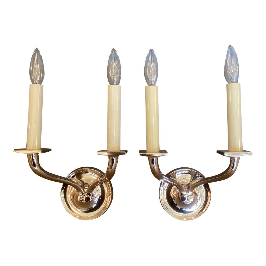 Pair of Restoration Hardware Attributed Chrome Two Arm Wall Sconces: Heavy well made pair of chrome 2 arm wall sconces in chrome believed to be Restoration Hardware but they are unmarked. Timeless transitional style. Candelabra sockets. Backplates included. Bulbs not i