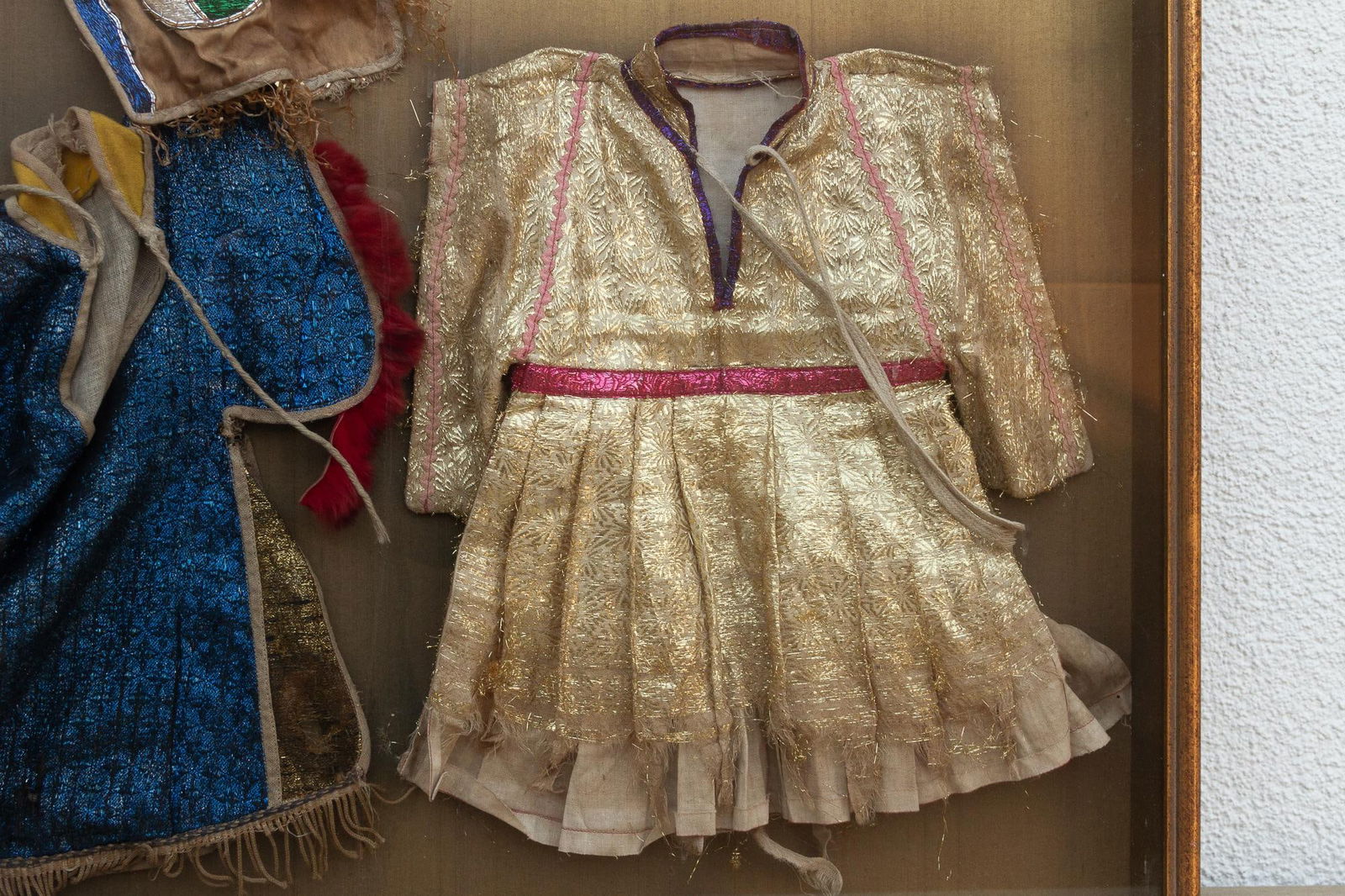 Framed Collection of Antique Children's Robes - 6