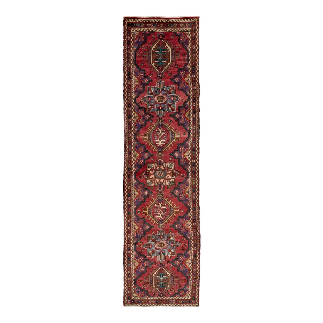 Vintage Red Heriz Handmade Tribal Wool Runner Rug in Red: This vintage hand-knotted wool runner features a red field adorned with geometric multicolor accents throughout the rug. This rug measures 3'5" x 12'8". Condition: Alterations: Original Condition