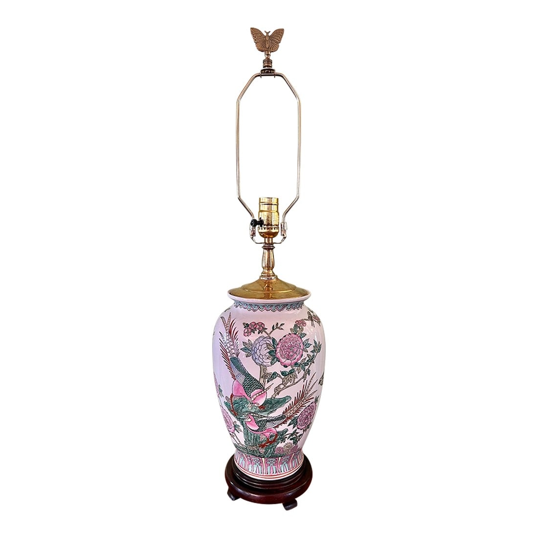 Late 20th Century Chinoiserie Porcelain Pheasant and Peony Lamp on Ming Base: The porcelain body on this chinoiserie lamp is filled with hand painted pheasants and peonies on a white background. The top and bottom are trimmed with aqua and pink geometrics. The body sits on a