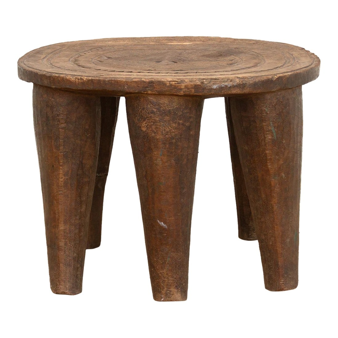 Rustic Finely Carved African Stool: A unique piece of African art, this vintage Nupe table from Nigeria is a must-have for collectors and enthusiasts of Nupe culture. Carved from a single log of wood and standing on 6 chunky tapered leg