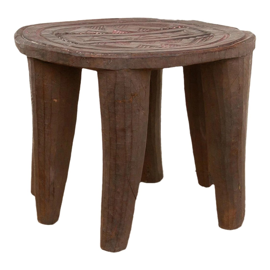 Patinated Brown Carved African Stool: A unique piece of African art, this vintage Nupe table from Nigeria is a must-have for collectors and enthusiasts of Nupe culture. Carved from a single log of wood and standing on 6 chunky tapered