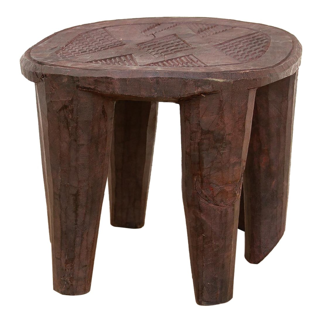 Small Carved Bida African Stool: A unique piece of African art, this vintage Nupe table from Nigeria is a must-have for collectors and enthusiasts of Nupe culture. Carved from a single log of wood and standing on 6 chunky tapered leg