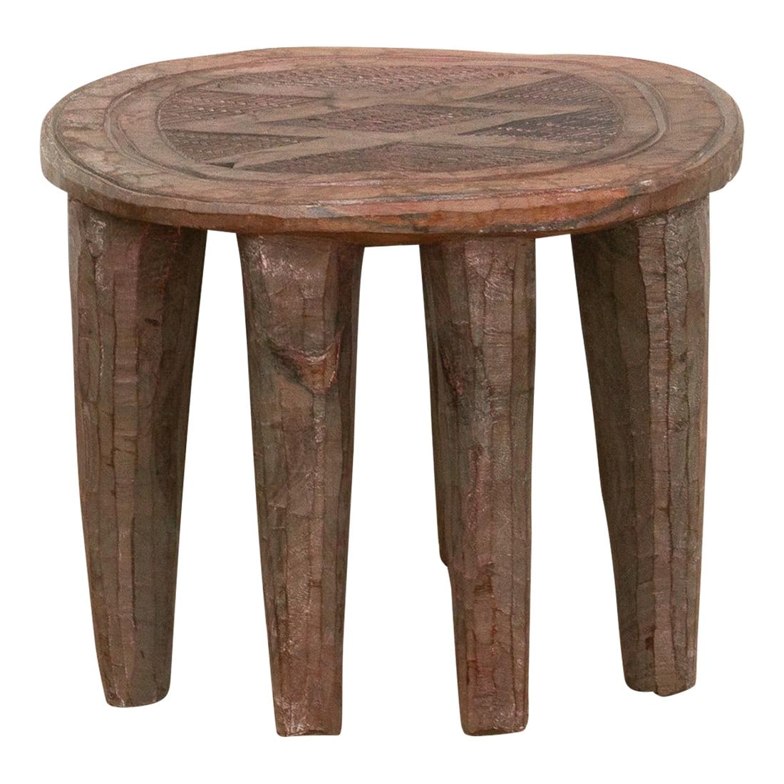 Carved Wood Tribal Round Table: A unique piece of African art, this vintage Nupe table from Nigeria is a must-have for collectors and enthusiasts of Nupe culture. Carved from a single log of wood and standing on chunky tapered legs,