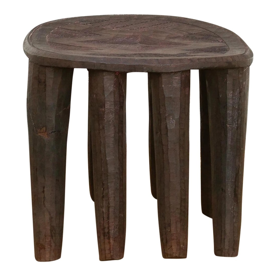 Charming Old African Nupe Side Table: A unique piece of African art, this vintage Nupe table from Nigeria is a must-have for collectors and enthusiasts of Nupe culture. Carved from a single log of wood and standing on chunky tapered legs,