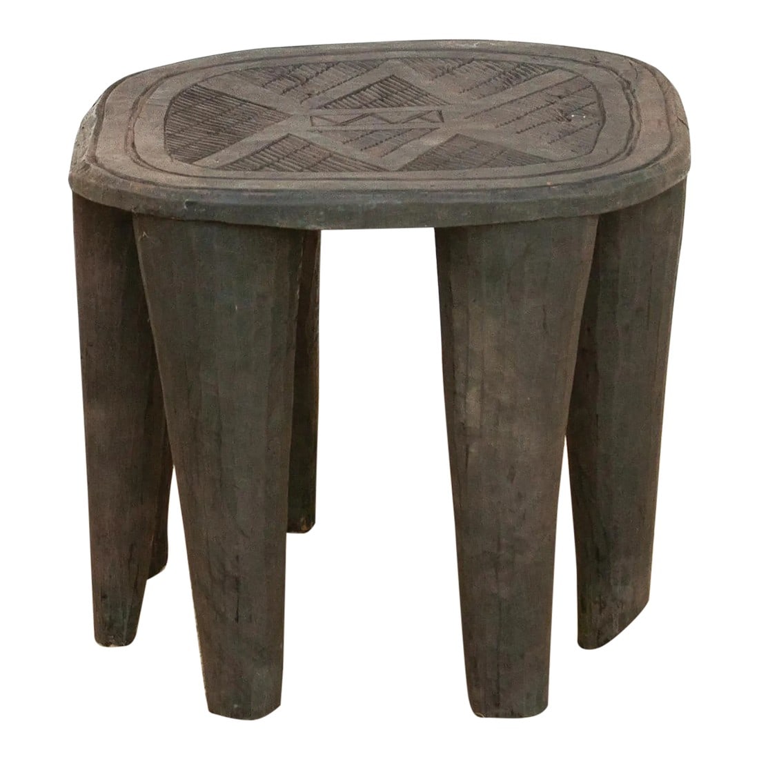 Original Nupe Carved Coffee Table: A unique piece of African art, this vintage Nupe table from Nigeria is a must-have for collectors and enthusiasts of Nupe culture. Carved from a single log of wood and standing on chunky tapered legs,