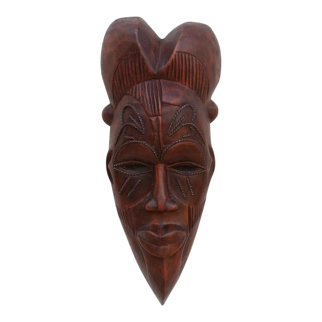 Ritual Crown, Carved Mask Wall Art: This charming Kwele mask from Gabon or the Republic of Congo is a delightful example of African tribal art. The mask is characterized by its simple yet expressive features, with a heart-shaped face, l