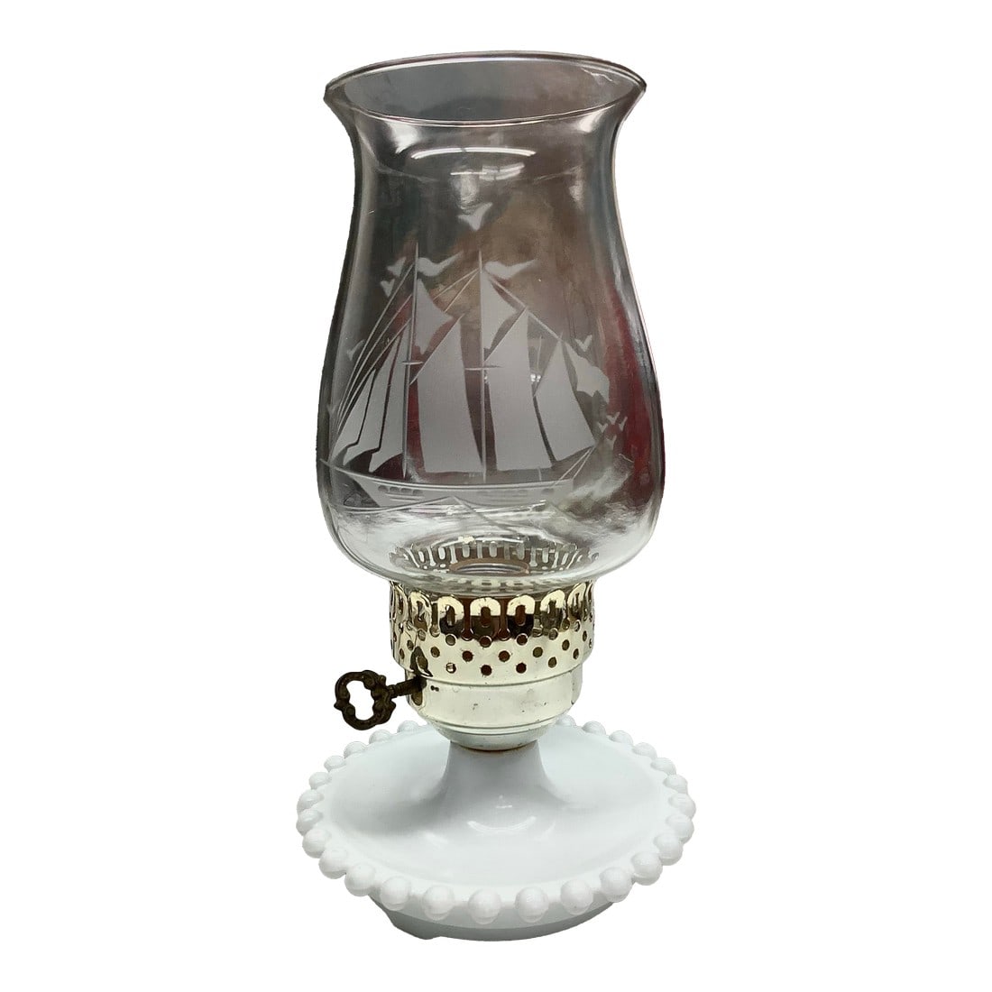 Mid Century Opaline Milk Glass Hurricane Lamp Nautical Theme: Vintage lamp with hobnail base and clear hurricane sailing ship chimney shade. Each little nub has a dot of gold paint on the top. The metal part of the lamp is a light gold tone with some tarnish.