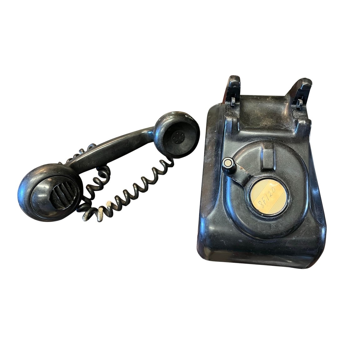 Early 20th Century Black Cranked Bakelite Hotel Phone: The Leich Company manufactured early magneto and dial equipment for the telephone industry. The Bakelite crank phone was used in various applications such as rural telephone systems, railroads, milita