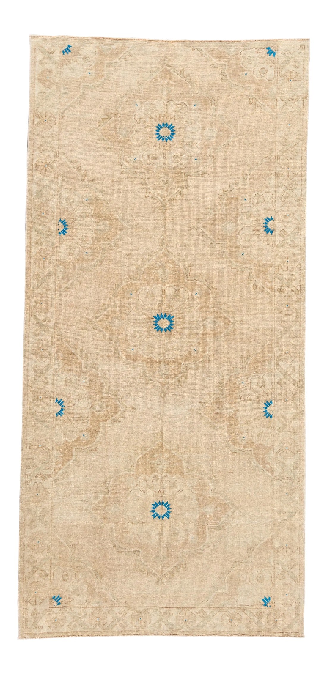 20th Century Vintage Turkish Anatolian Rug: A hand-knotted vintage Turkish Anatolian rug with an all-over design with ivory and blue accents. This rug measures 4'11" x 10'5". Condition: Alterations: Original Condition Unaltered