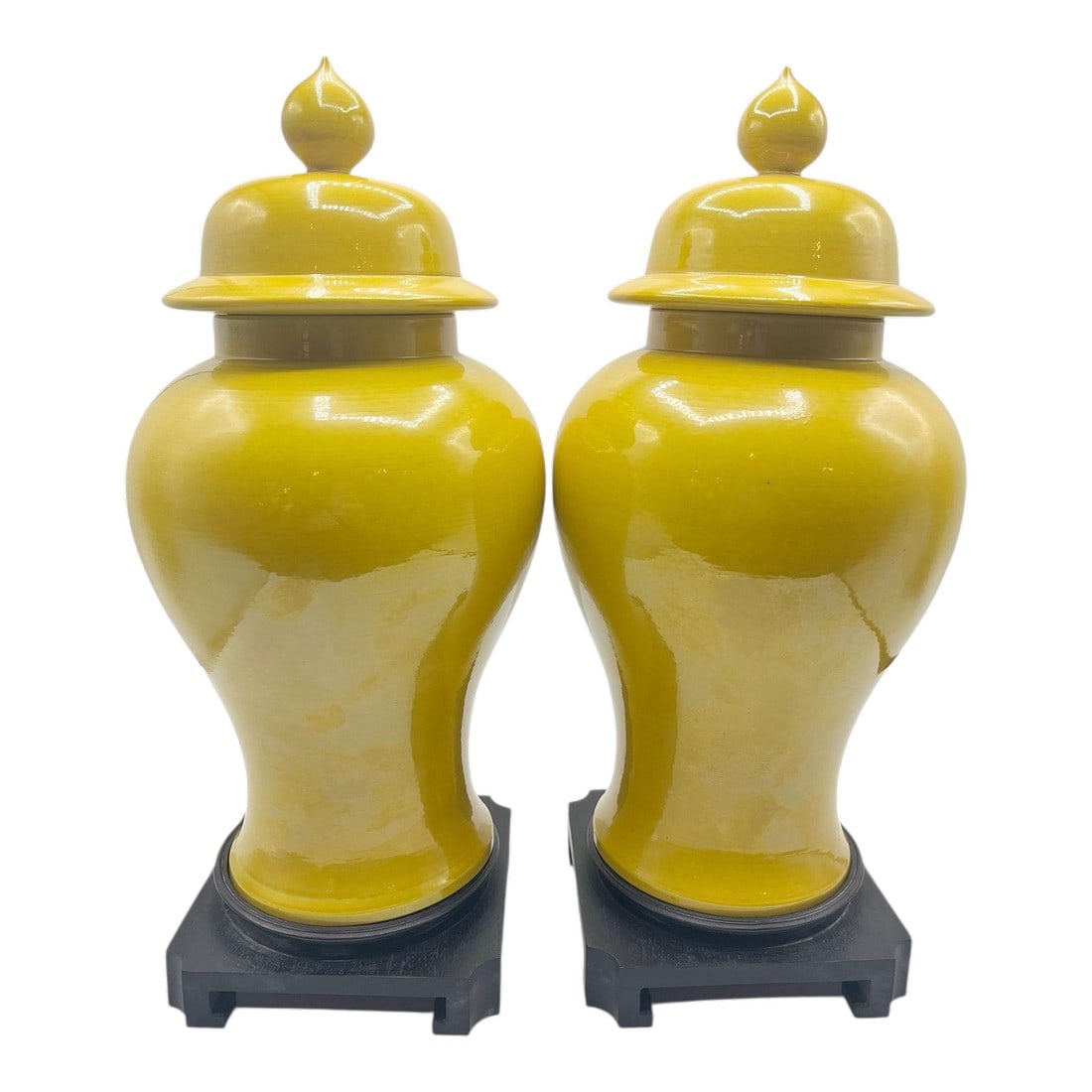 Vintage Japanese Lidded Urns - A Pair: A beautiful pair of Japanese lidded urns, each gracefully poised on its own custom wooden stand. These elegant vessels showcase traditional craftsmanship with a rich glaze and classic form. Perfect