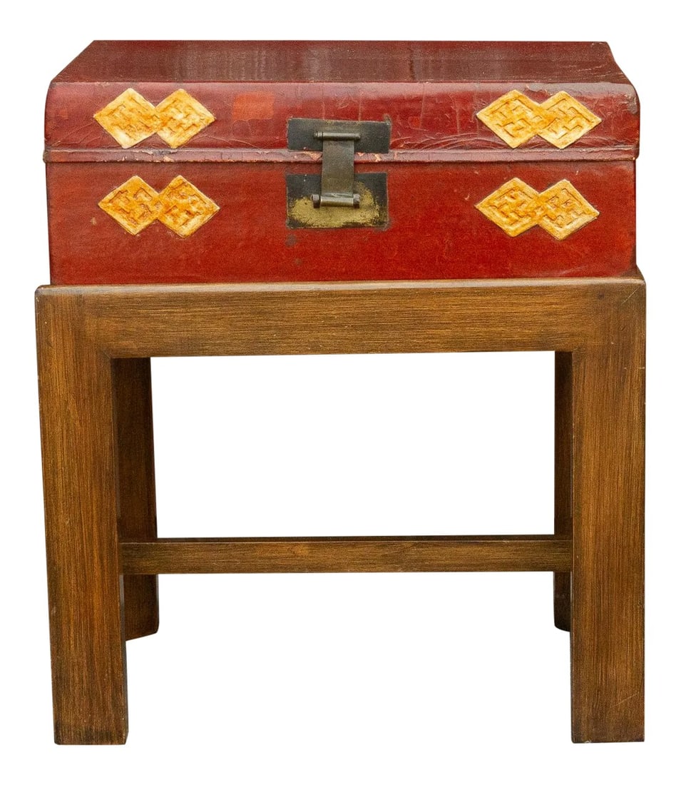 Chinese Antique Lacquer Document Box on Wooden Stand: Chinese antique crimson gilt lacquer leather document box. It features a gilt geometric design on the outside and a blue linen lined interior. Its adorned with bronze hardware and sits on a custom sta