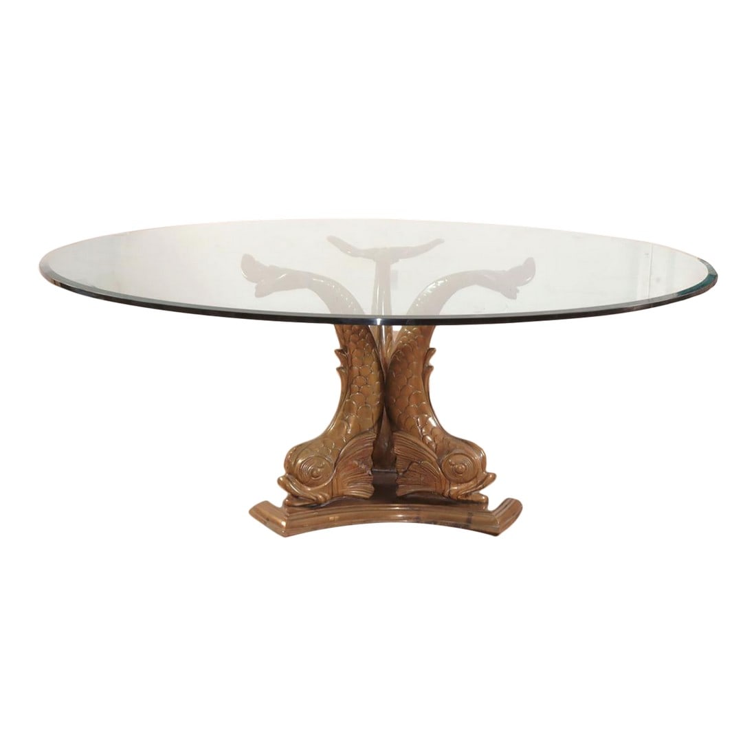 Round Glass Top Dining Table With a Three Dolphins Solid Brass Base. Mid Century Modern Meets: I guess this would be considered a grotto style dining table. The piece of glass on top is just over six feet wide and is monumental. It's probably weighs 500 pounds and is very hard to move (attn