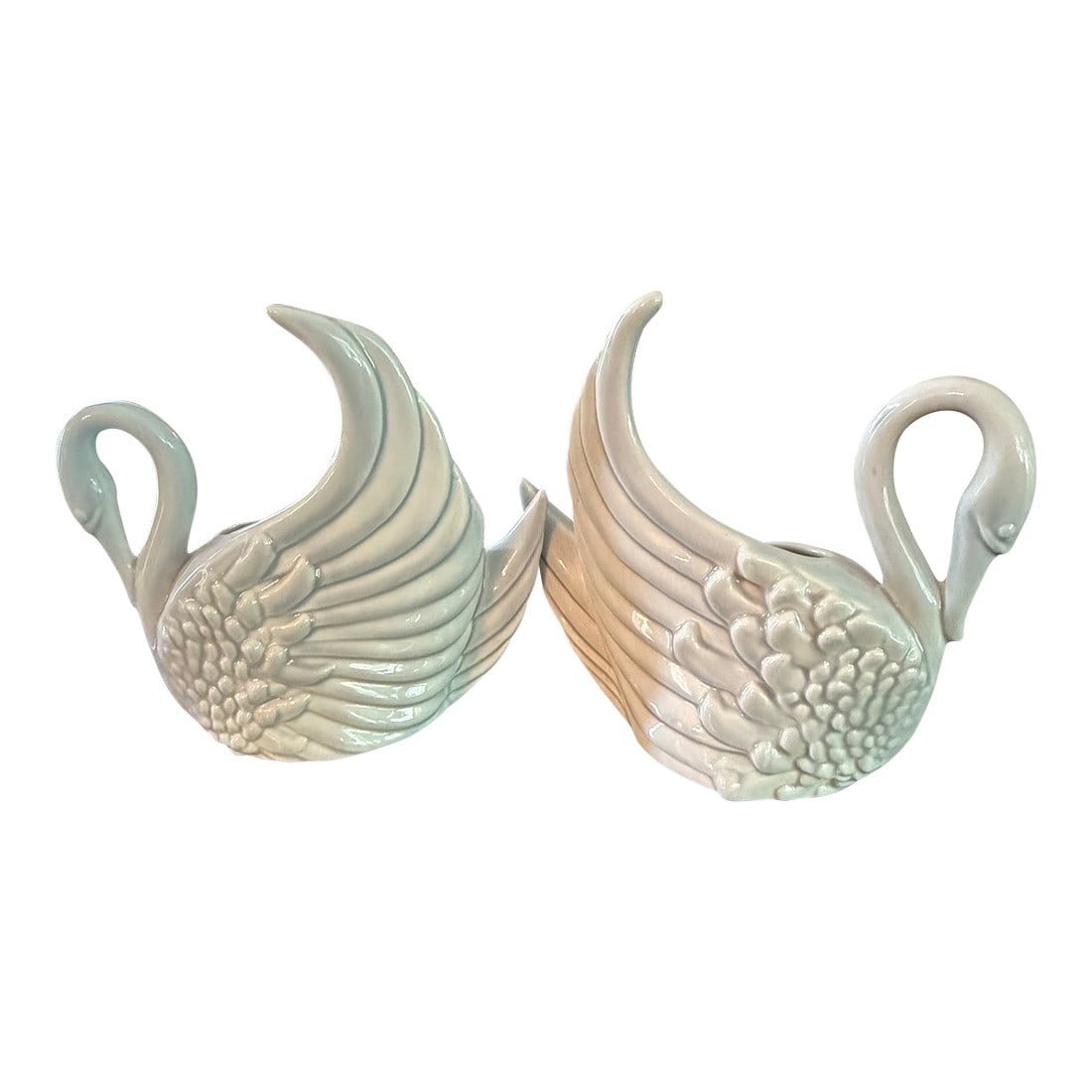 Rare Set of Mid Century Modern Royal Haeger Swan Vases: A rare set of Royal Haeger swan vases. The ceramic vases are a light gray in color. It is extremely rare to find both a left facing and a right facing set of swans. The graceful lines of this pair