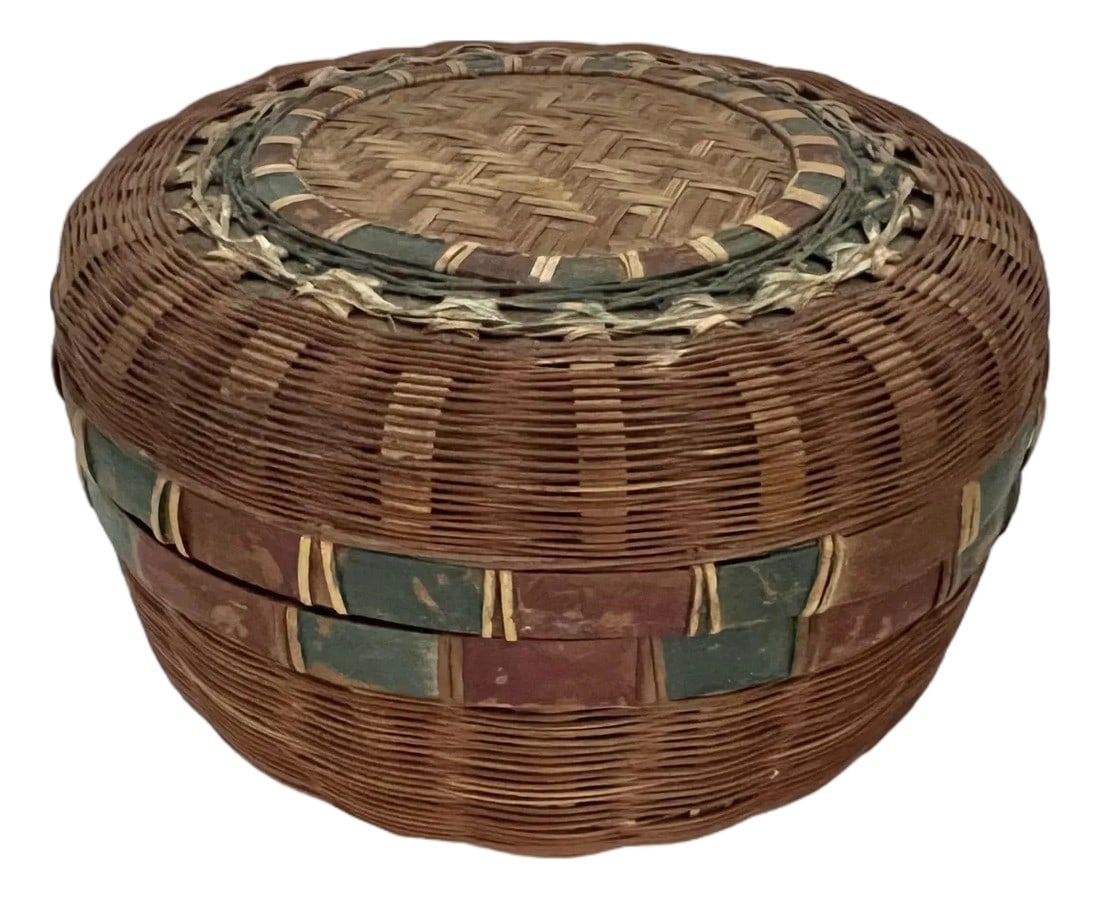 Antique Round Lidded Weaved Chinese Box: Antique Round lidded Chinese woven basket. This basket has a geometric pattern on the top of the lid and alternating red and green band on top and bottom closure. Originally sold filled with dried