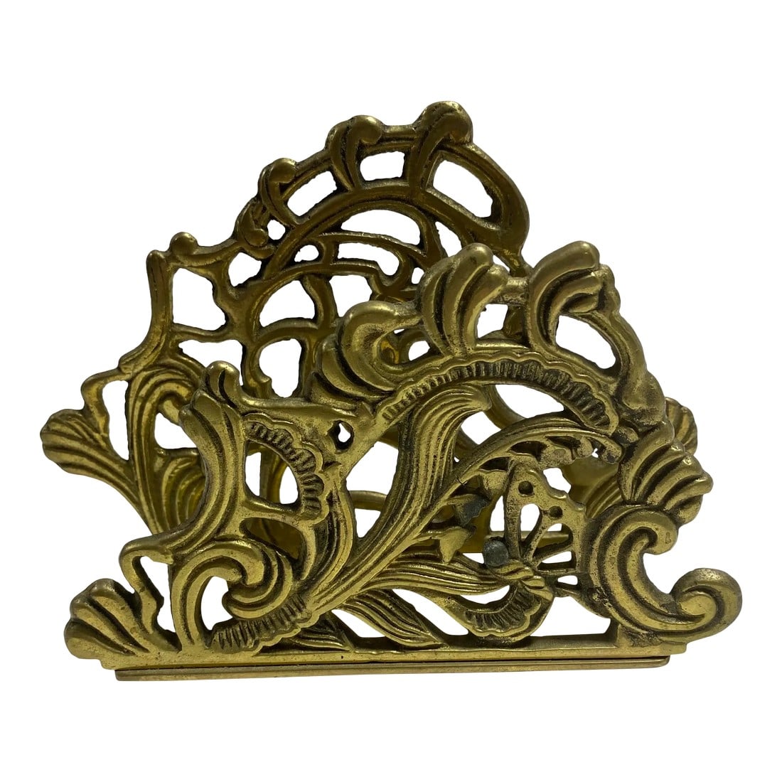 1950s Brass Filigree Letter Holder Napkin Holder: Beautiful ornate vintage brass napkin holder or letter holder. A nicely scrolled and weighted solid brass, made in England. In wonderful condition. Unpolished. Condition: Alterations: Original