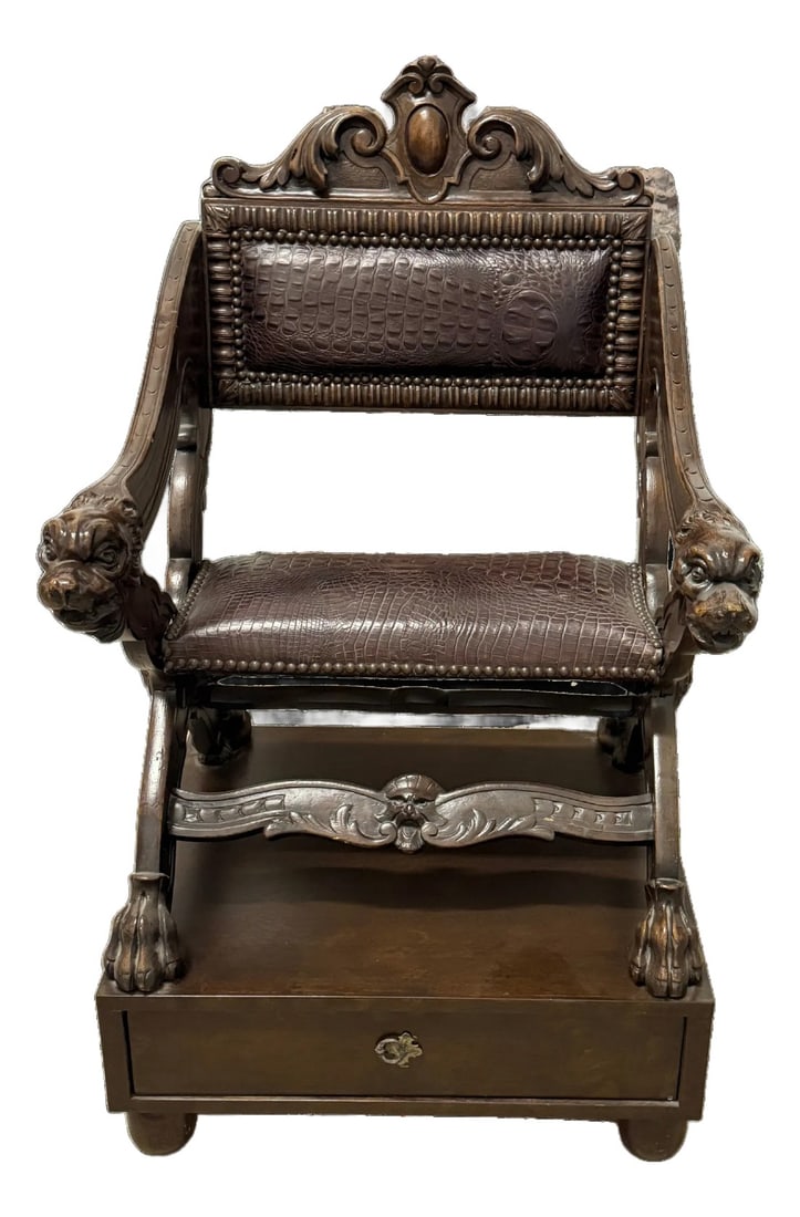Early 20th Century Carved Dog-Head Savonarola Chair With Drawer Base, Renaissance Revival Style: Renaissance Revival–style Savonarola chair with carved dog-head arm terminals, scrolled cresting, and paw feet. The X-form frame is mounted on a later fitted drawer base with carved apron and