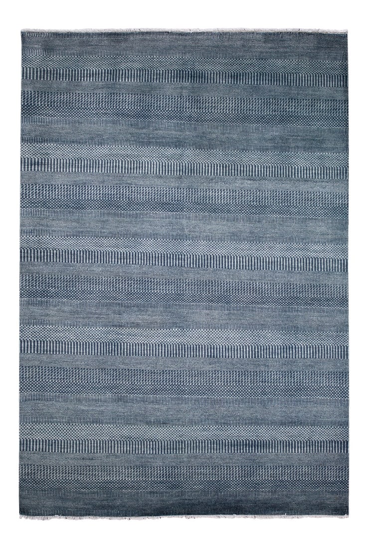 20th Century Vintage Savannah Style Wool Rug: Beautiful hand-knotted wool, Savannah-Style vintage rug. This rug has a navy blue field with subtle blue toned accents in a solid pattern. This rug measures 6' 1" x 9' 2" Condition: Alterations: