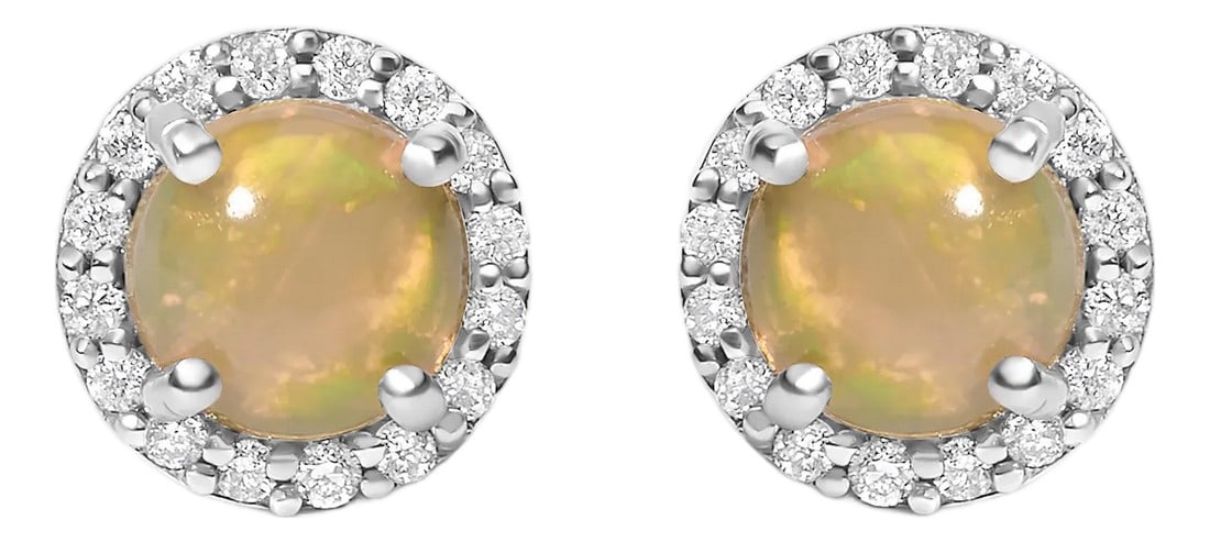 10K White Gold Opal and 1/6 Cttw Diamond Halo Stud Earring: Immerse yourself in the allure of these exquisite 10K white gold stud earrings, each centered with a captivating 5mm natural opal, treated to deepen its allure. This gemstone, embraced by four secure