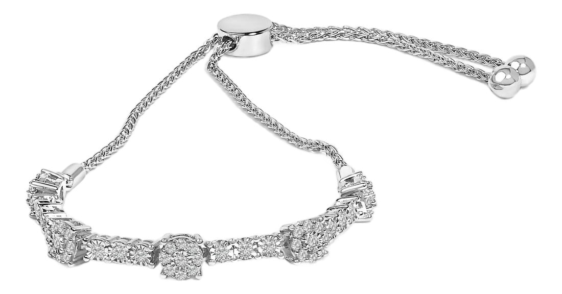 .925 Sterling Silver 1/2 Cttw Diamond Cluster and Bar Bolo Bracelet: Discover the enchanting brilliance of the .925 Sterling Silver Diamond Cluster and Bar Bolo Bracelet, a masterful blend of elegance and versatility. Crafted from the finest sterling silver, this piece