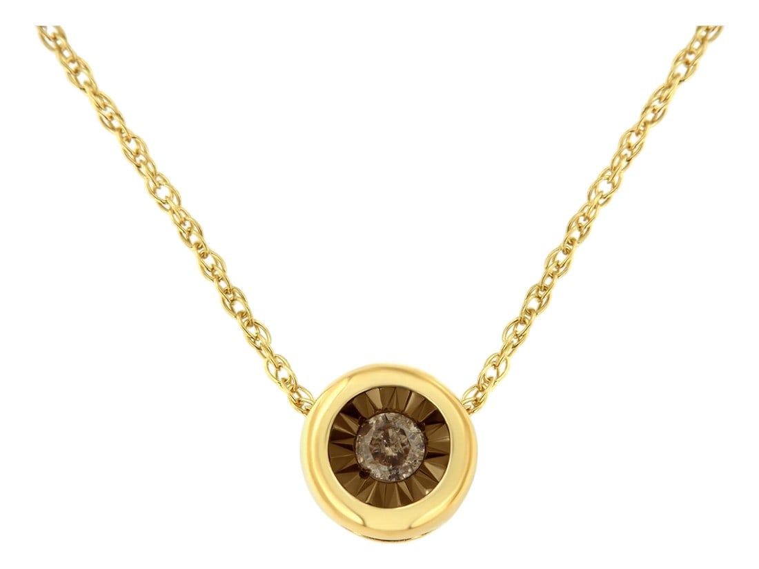 10K Yellow Gold over .925 Sterling Silver 1/10 Carat Diamond 18" Round Miracle-Plate Two-Tone Pendan: Enjoy this delicate pendant necklace featuring a single miracle set diamond in a bezel setting. This delicate necklace is crafted in two-tone sterling silver and has a total diamond weight of 1/10
