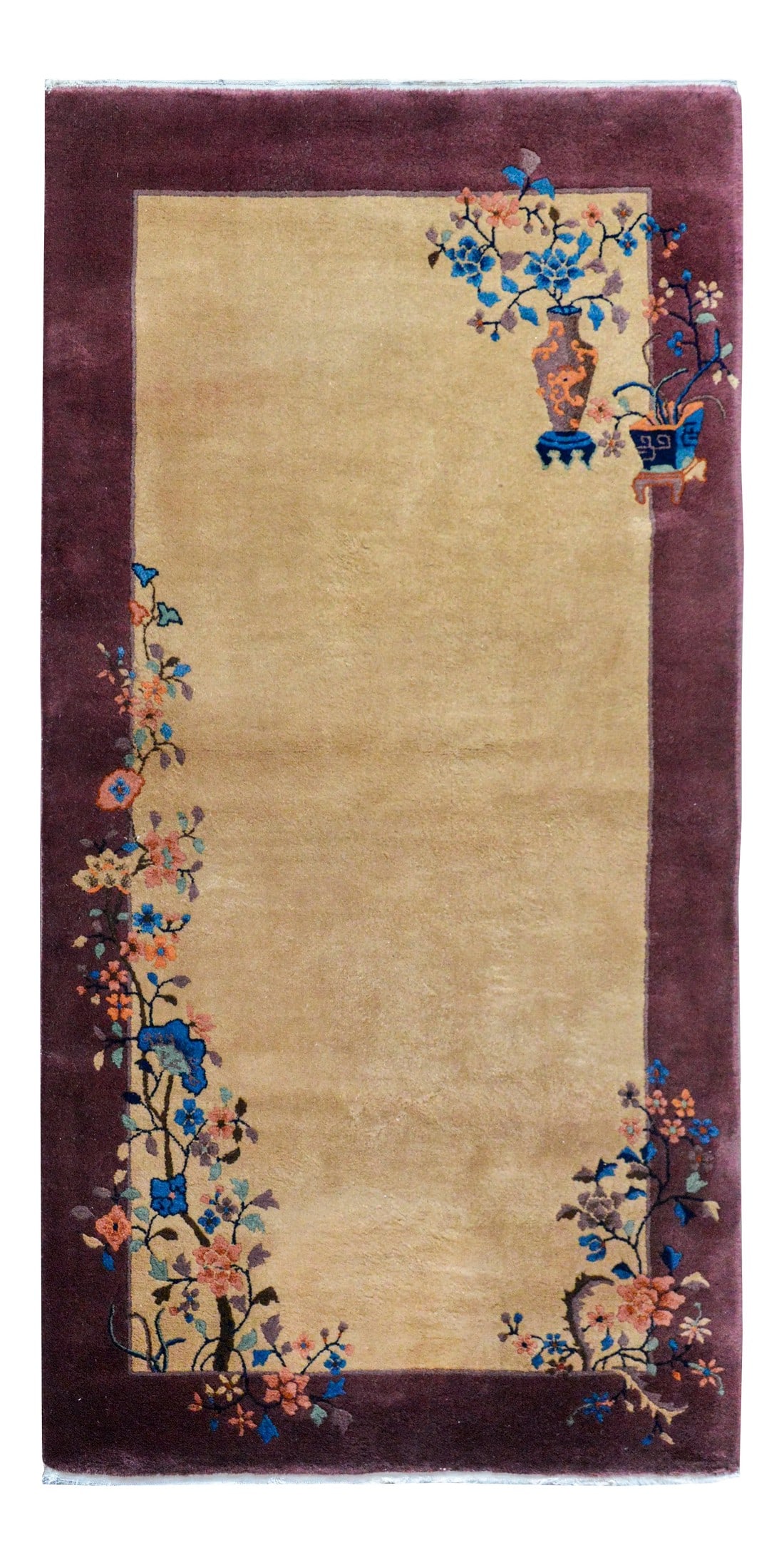 Early 20th Century Chinese Art Deco Rug: A wonderful early 20th century Chinese Art Deco rug with a beautiful solid beige background with a wide purple border, and overlaid with multi-colored auspicious flowers including peonies and cherry