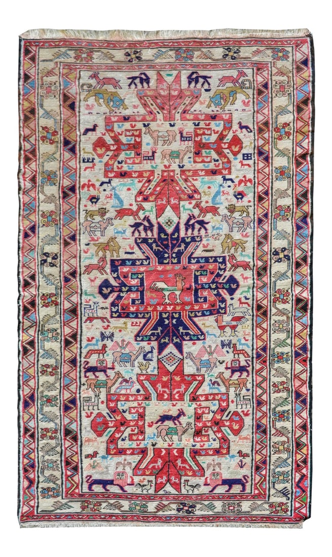 Vintage Soumak Rug: A gorgeous vintage Persian Soumak rug with mural animals including chickens, camels, lions, goats, and tigers, all woven in red, indigo, pink, green, and gold against a white background, and