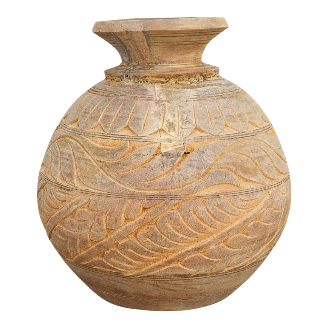 Carved Bleached Naga Water Pot: Hand-carved antique water pots crafted from solid wood with such skillful artistry, this pot is originally from the Naga tribe in India and used to transport water. This piece features beautifully det