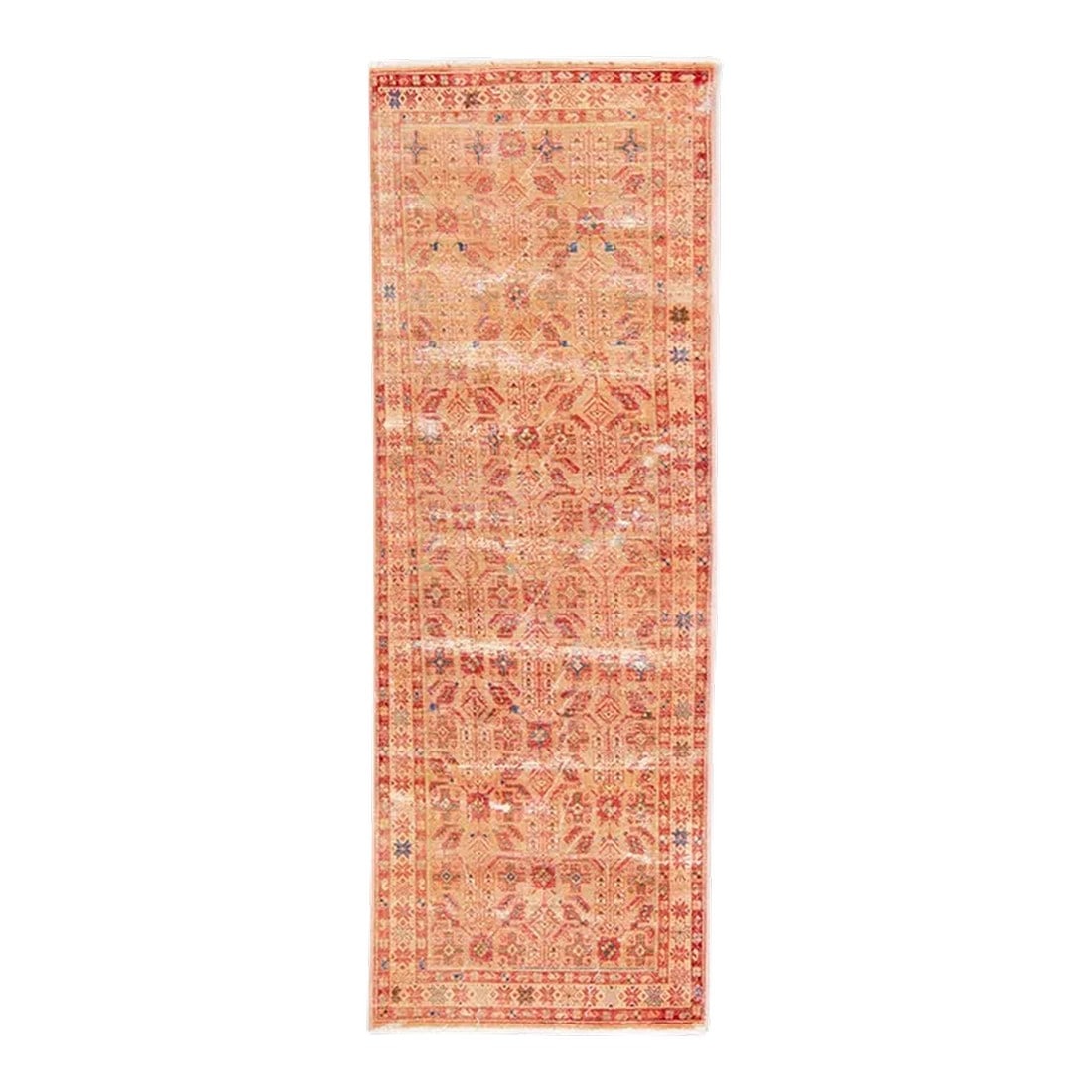 1960s Vintage Distressed Handmade Floral Peach Wool Runner: Beautiful Vintage Floral hand-knotted wool runner with a peach field. This runner has blue, pink and tan accents all-over a geometric floral distressed design. This rug measures: 3'7" x 10'5". 