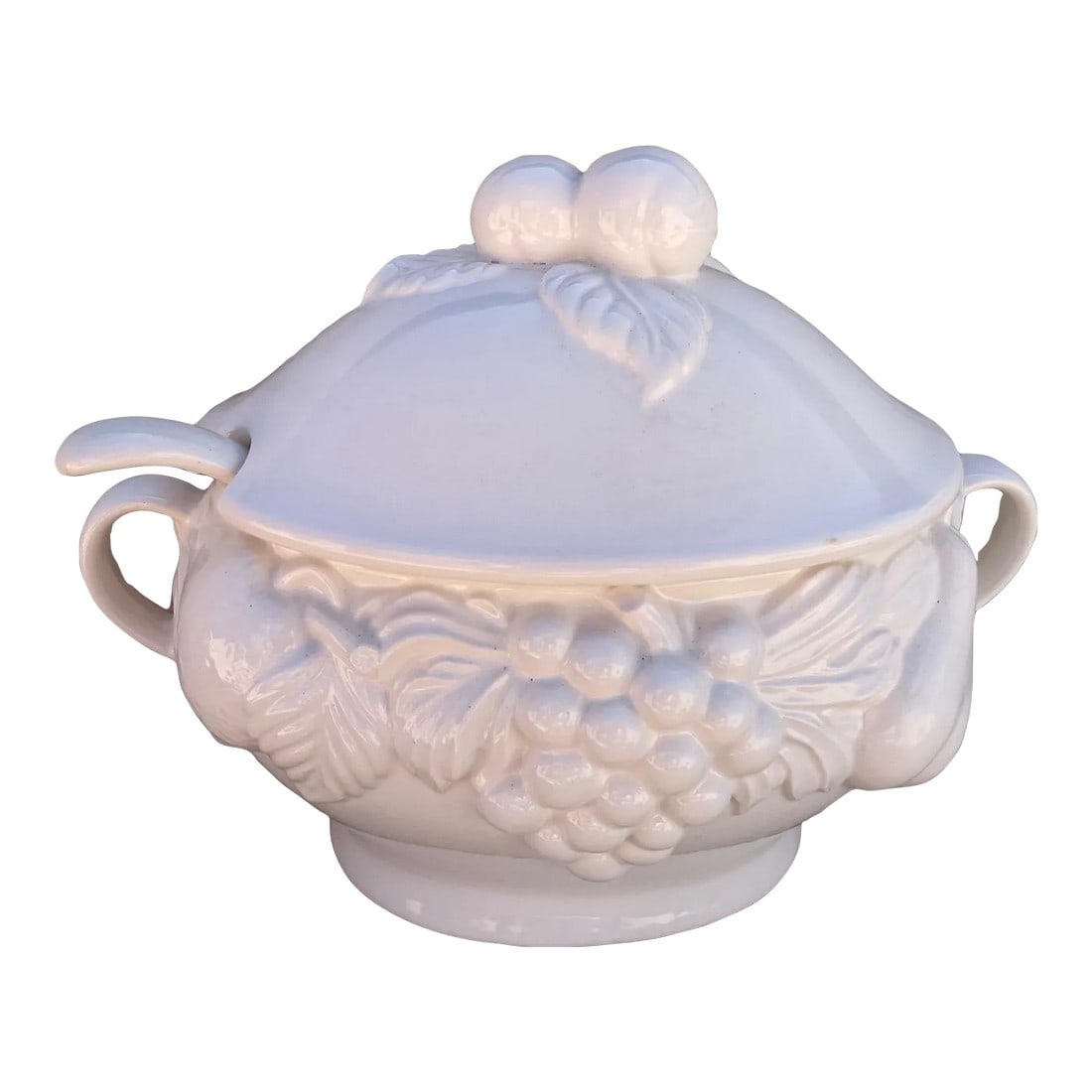 Vintage White Italian Soup Tureen W/Ladle: Vintage white Italian Soup Tureen w/Ladle Fruit pattern throughout and handles on the sides. Great for the holidays. Marked on bottom "over and back" made in Italy 10in h x 12in w 8in x 5.5in opening