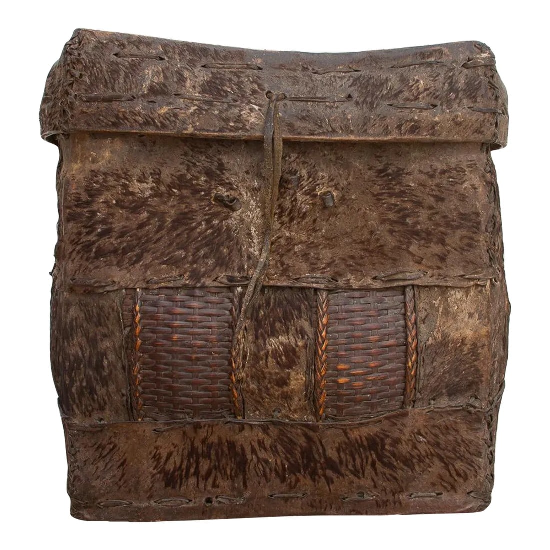 Rare Antique Hide Trunk From Bhutan: A rather unique early 20th century storage basket from Bhutan. This tribal trunk, originally found along the ridges of the Himalayas, has a bamboo frame covered with hide. This antique Asian trunk was