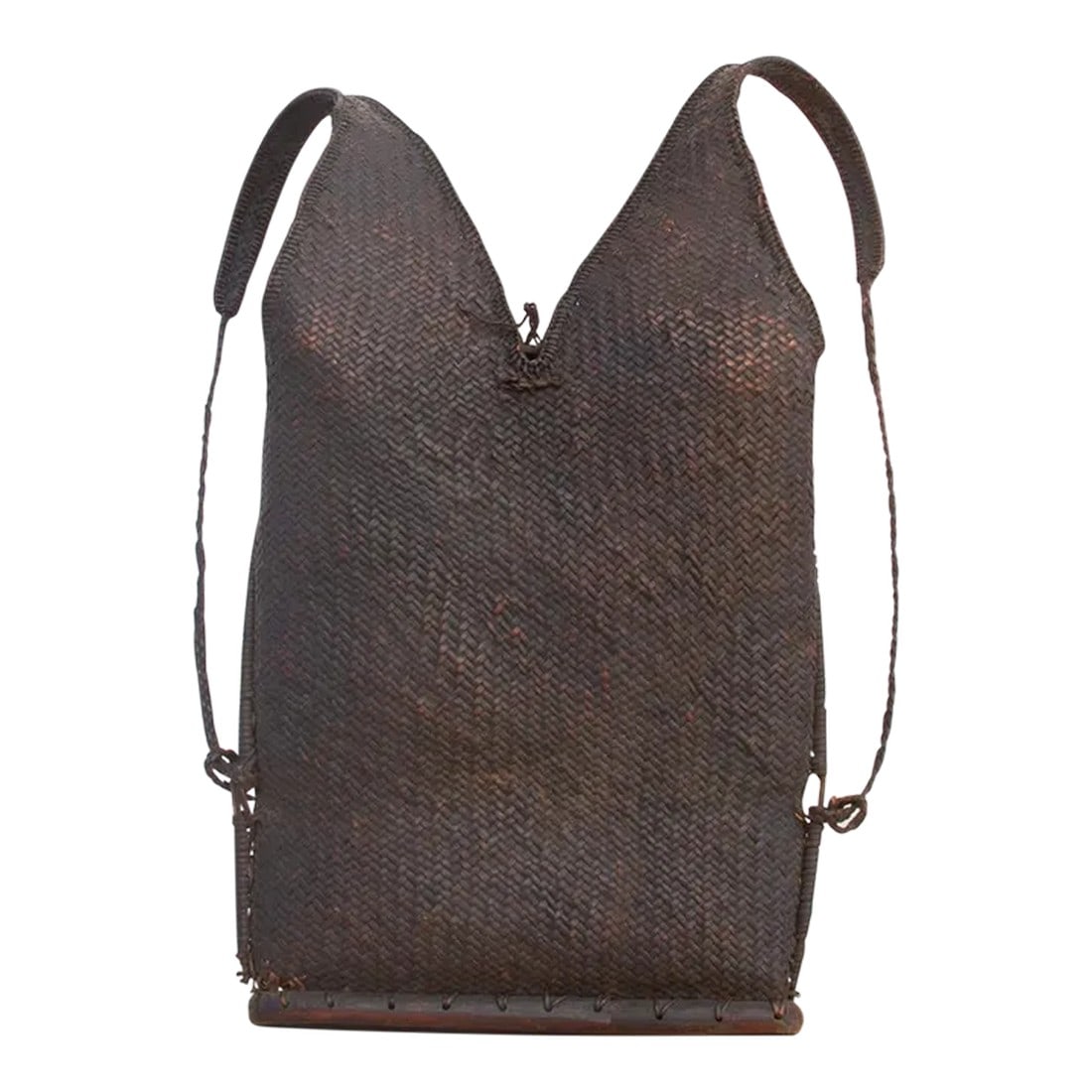 Dark Brown Antique Naga Backpack: Found in the villages around Nagaland, an indigenous territory on the border of India and Myanmar. This unusual school bag is finely woven and has its original carrying rope straps. The antique Naga r