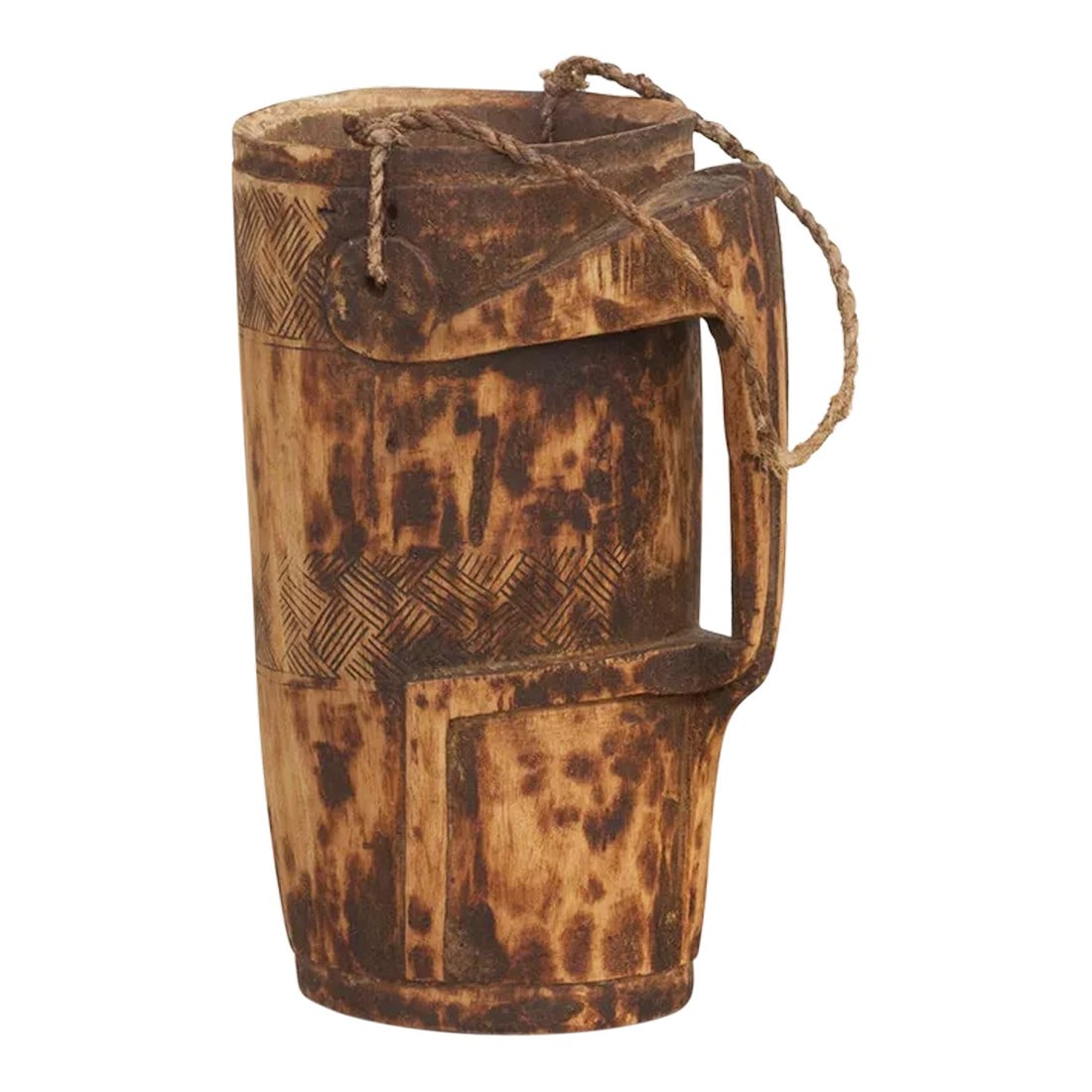 Hand-Carved Naga Milk Pot-Konyak: Primitive and beautifully hand-carved wooden milk jug from the tribes of Nagaland. This vessel is adorned with geometric tribal designs, a rope handle and a side handle that is a carved stylized form