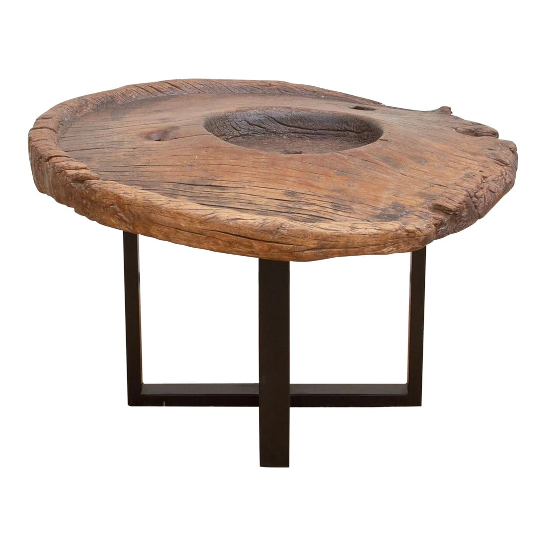 Ancient Java Grinder Coffee Table: Grinding wheels have been used for thousands of years to grind pigments and grains. One of the earliest known examples of a grinding wheel comes from Java, an island in Indonesia in which they were