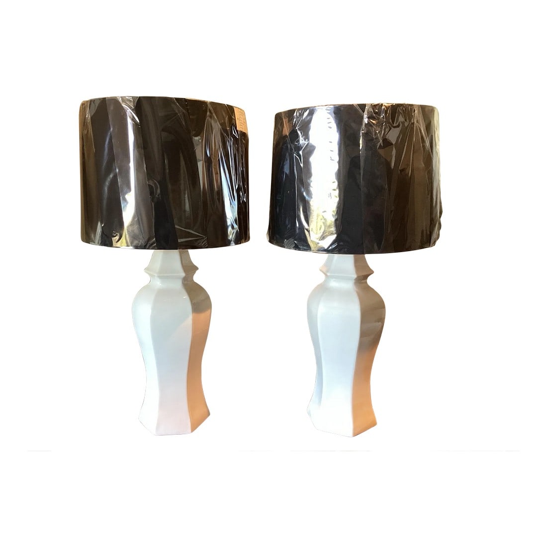 1970s Pair of White Pagoda Lamps With Black Drum Shades: What I love about these is the small scale allows them to be used in a number of different settings. They be equally wonderful as bedside lamps or on a console table. I love the juxtaposition of the