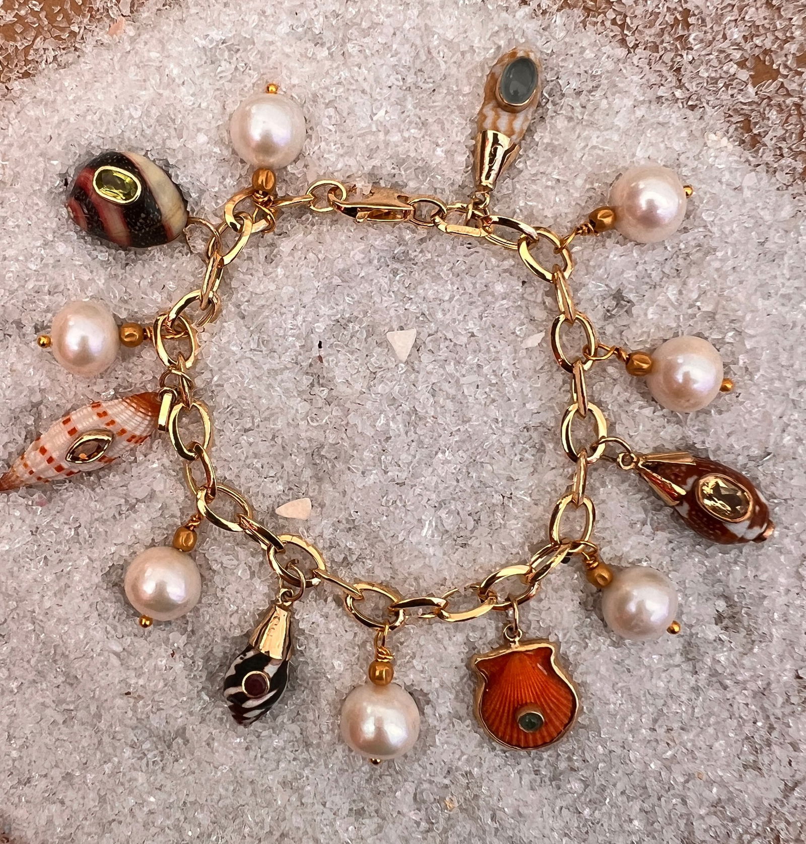 14-karat Charm Bracelet with Pearls & Shell Charms: Title:14-karat Charm Bracelet with Pearls & Shell Charms Description:Exquisite 14-karat oval link charm bracelet with Yantze Pearls, 18th c. 18-karat Afgani beads and six 14-karat gold Assorted Shell
