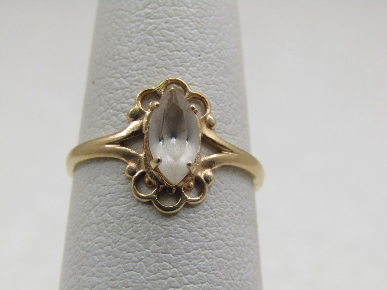 Vintage 10kt Clear Stone Ring, Sz. 5, Signed PSCO-P: Title:Vintage 10kt Clear Stone Ring, Sz. 5, Signed PSCO-PDescription:Vintage 10kt Clear Stone Ring, Sz. 5, Signed PSCO-P, 1.08 gr. The stone may be clear quartz - marquise appx 7.5mm by 4.5mm. Open