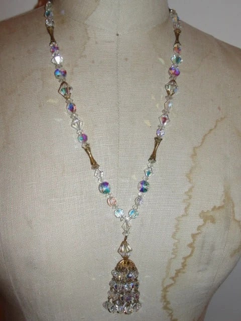 Swarovski Crystal & Brass Tassel Necklace: Title:Swarovski Crystal & Brass Tassel Necklace Description:Gorgeous tassel necklace. Not like other tassel necklaces, this one is made from crystal. Crystal beads are spaced with brass beads as well.