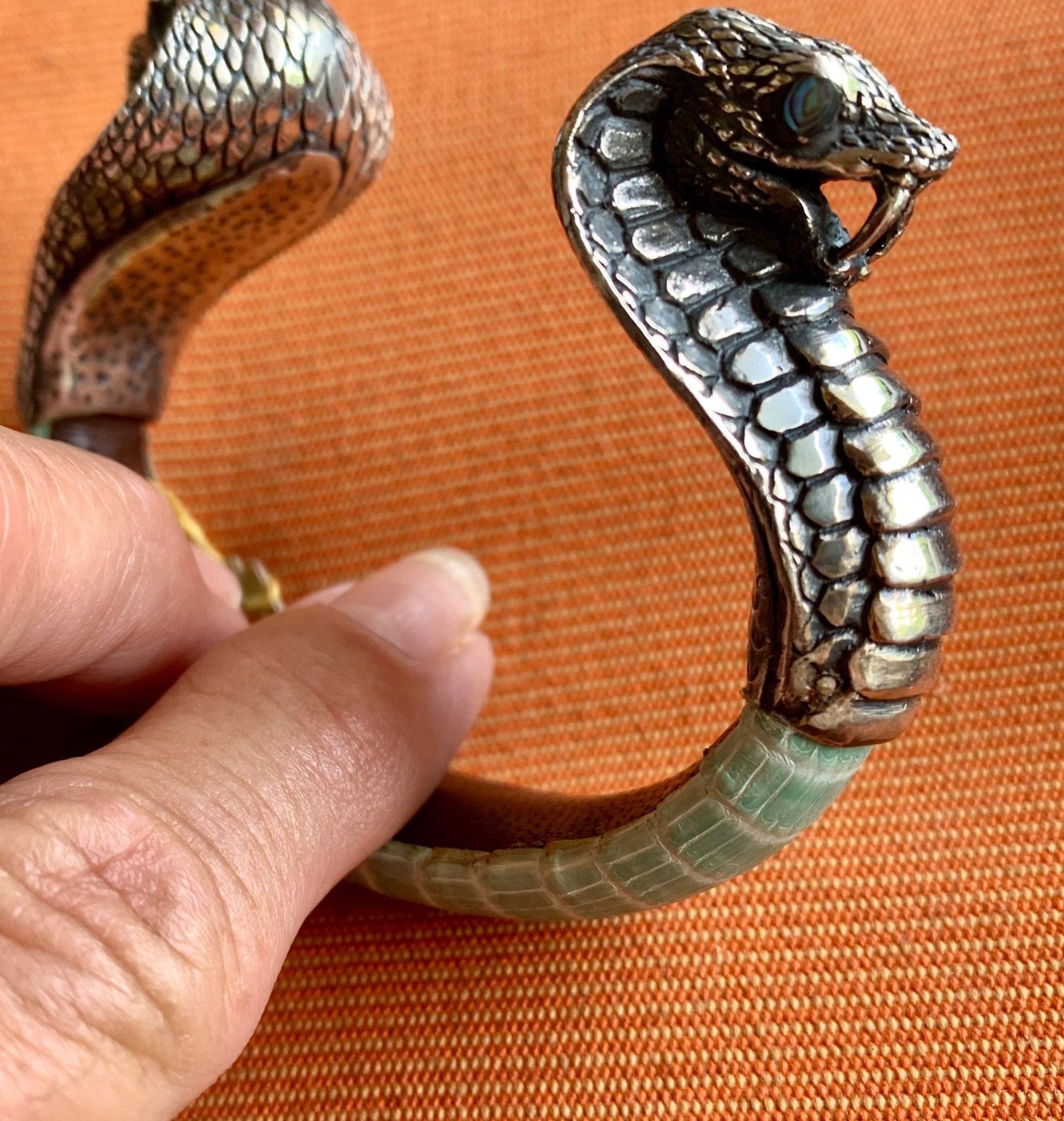 Aqua Lizard-Skin Cuff Bracelet with Sterling Cobra: Title:Aqua Lizard-Skin Cuff Bracelet with Sterling CobraDescription:Exotic Lizard-Skin cuff with double-headed Cobra. Eyes of Abalone. Made and signed by Lou Guerin of Bali Reserve: $580.00 