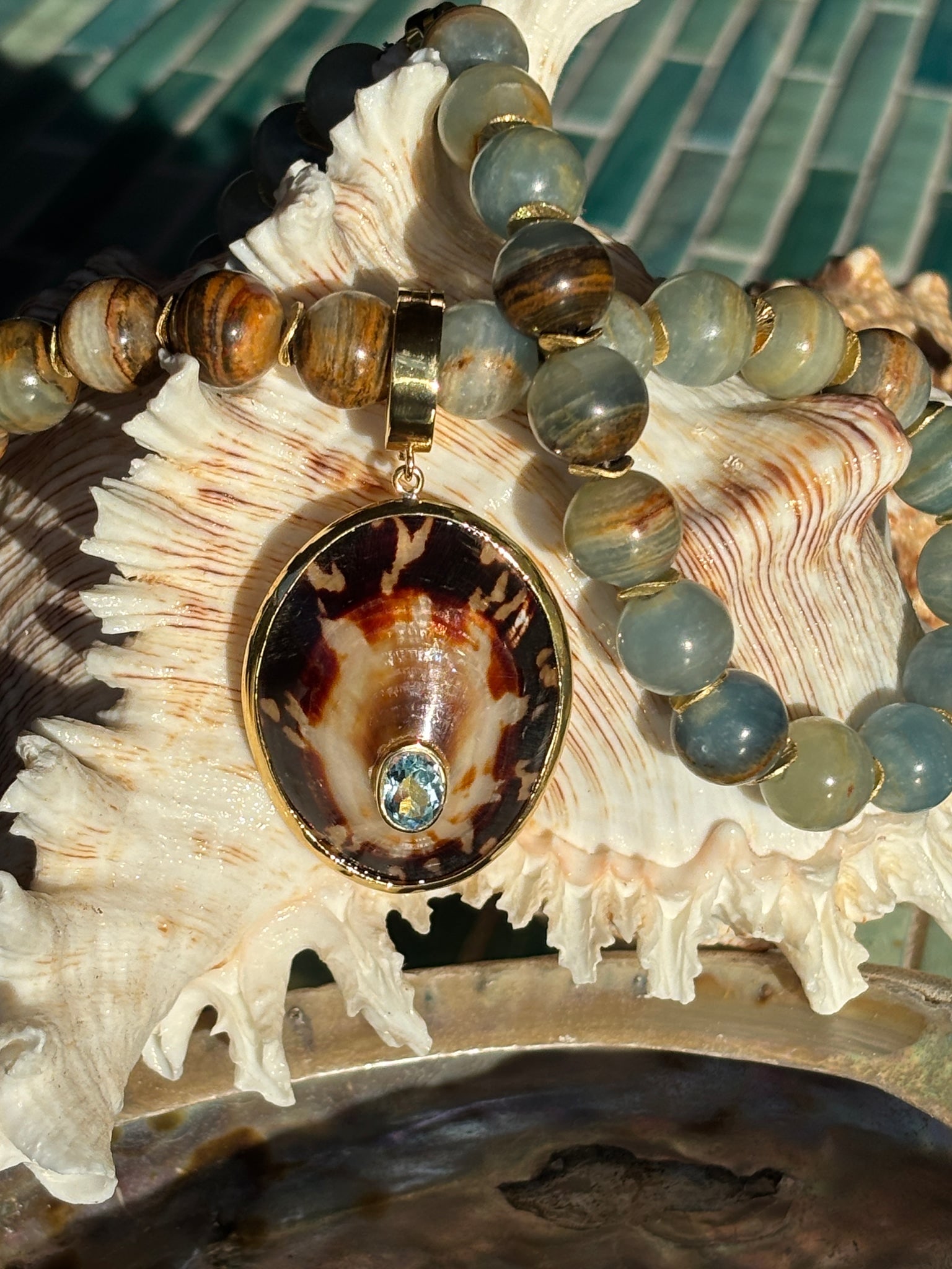 Ocean Jasper and Limpet Necklace: Title:Ocean Jasper and Limpet NecklaceDescription:Fascinating Ocean Jasper is made of the stuff of the sea—from the color of the water to the sea weeds and corals. There is also Ocean Floor