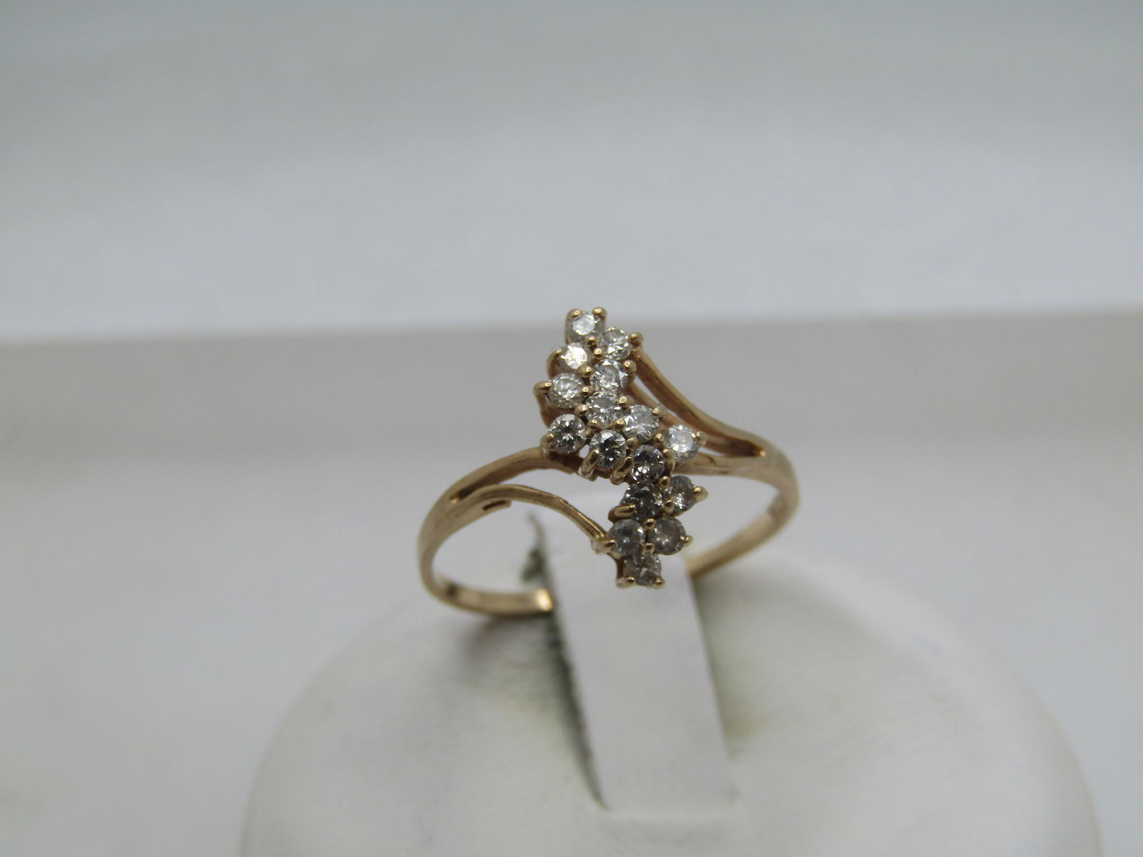 Vintage 10kt Diamond Cluster Waterfall Ring, Sz. 6, 1980's-1990's: Title:Vintage 10kt Diamond Cluster Waterfall Ring, Sz. 6, 1980's-1990'sDescription:Vintage 10kt Diamond Cluster Waterfall Ring, Sz. 6 1980's-1990's. 10kt yellow gold. This has sixteen round, appx.