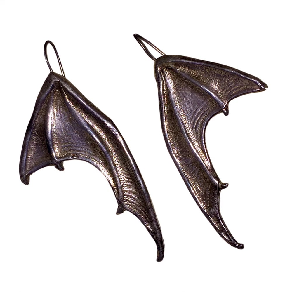Sterling Silver Bat Wing Earrings Alberto Juan: Title:Sterling Silver Bat Wing Earrings Alberto JuanDescription:Amazing, unique, bat wing earrings. Fun recasts of a vintage 1980's finding. Sterling silver, each earring measures 3" long by 1 1/2"