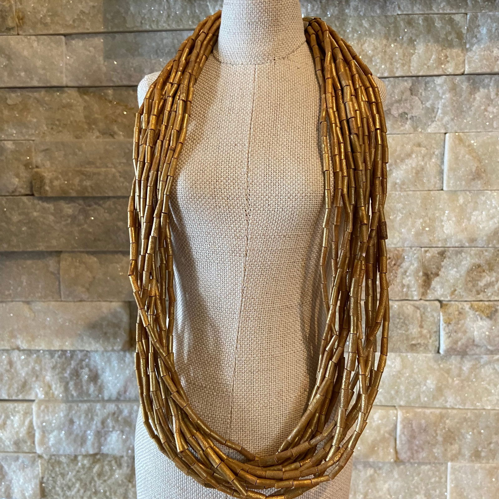 Vintage 14 Multi-Strand Golden Coarl Beads Necklace: Title:Vintage 14 Multi-Strand Golden Coarl Beads Necklace Description:This exquisite piece exudes timeless elegance with its rich, golden coral beads meticulously strung into 14 lustrous strands. The