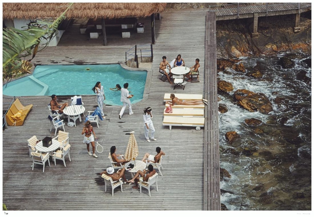 Decking By The Sea 1988 - Slim Aarons Estate Stamped: 1988 (printed later): Title: Decking By The Sea 1988 - Slim Aarons Estate Stamped: 1988 (printed later) Description: Decking By The Sea 1988 - Slim Aarons Estate Stamped People sunbathing on a deck overlooking the sea at