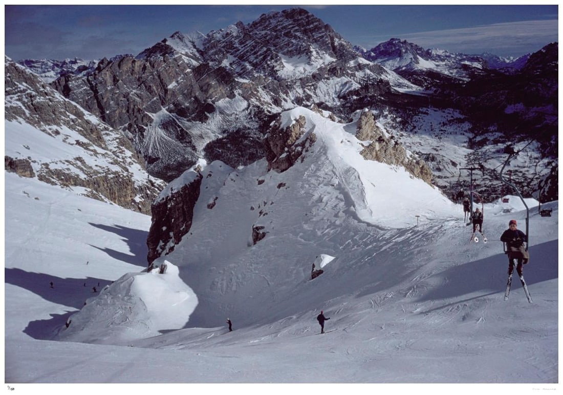 Cortina d’Ampezzo 1962 - Slim Aarons Estate Stamped: 1962 (printed later): Title: Cortina d’Ampezzo 1962 - Slim Aarons Estate Stamped: 1962 (printed later) Description: Cortina d’Ampezzo 1962 - Slim Aarons Estate Stamped A chairlift up the mountain in Cortina